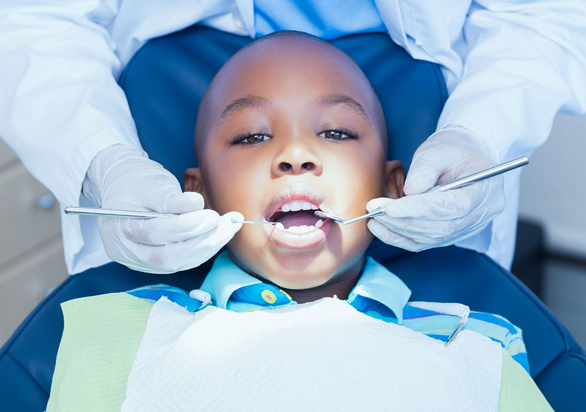 A child is having dental surgery.