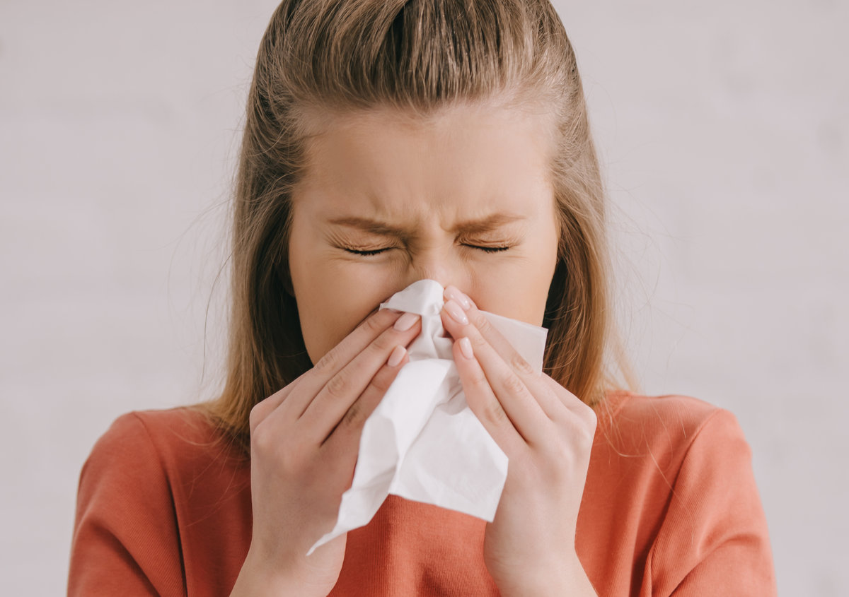 A woman experiencing flu symptoms.